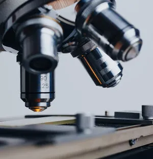 Close-up view of a medical microscope used for diagnostics in a clinical laboratory